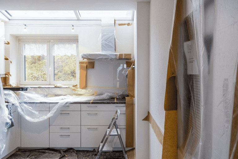 High-end kitchen renovation project in San Antonio featuring modern white cabinetry and premium countertops by DKI Remodeling & Construction
